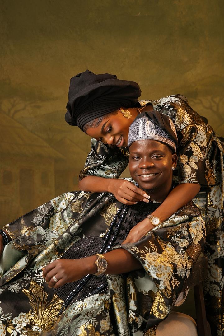 Couple embrace in matching brocade